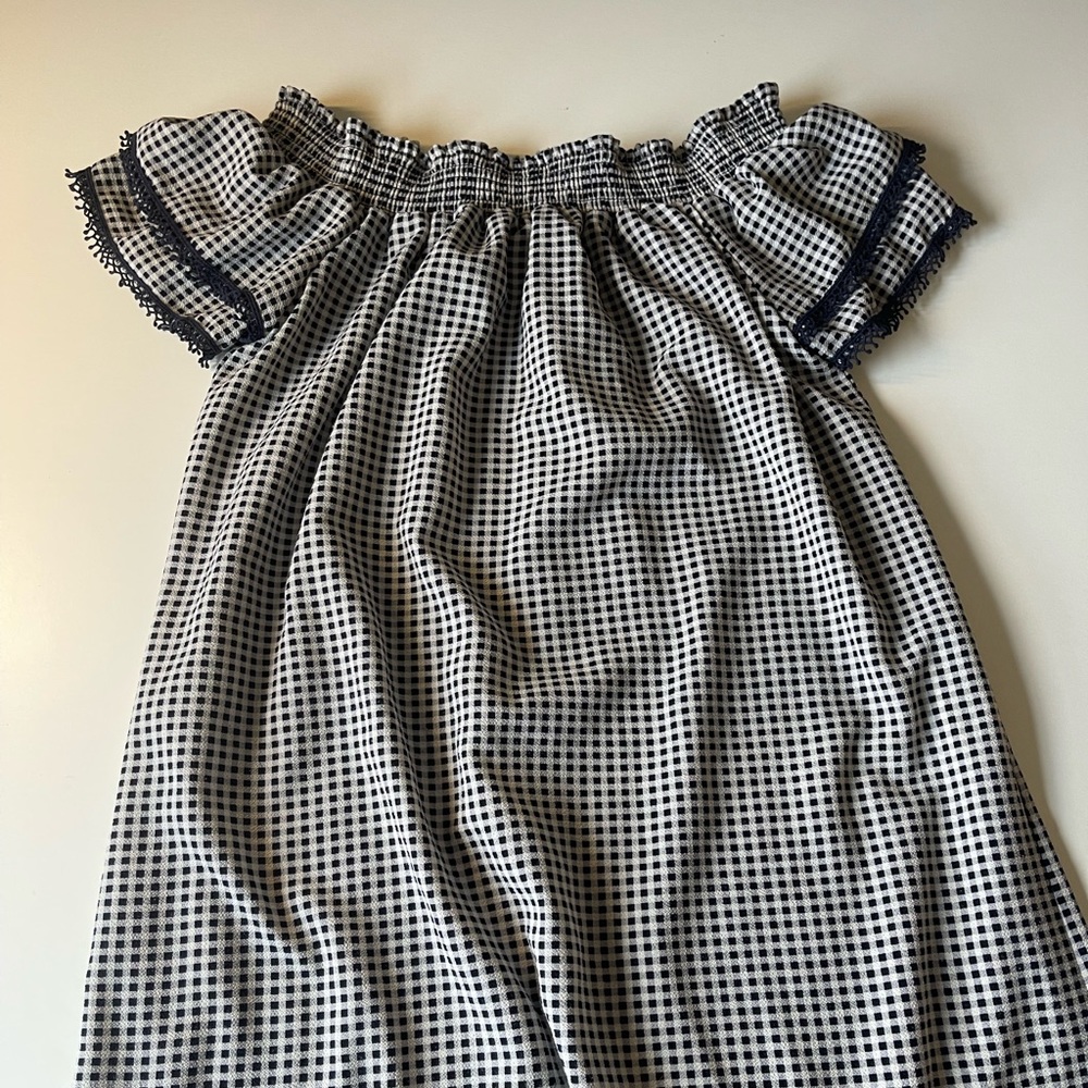 Strapless, navy and white checkered sun dress, and an elastic band on the top!